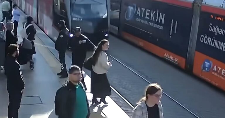 Security Guard Saves Distracted Pedestrian from Oncoming Tram.jpg