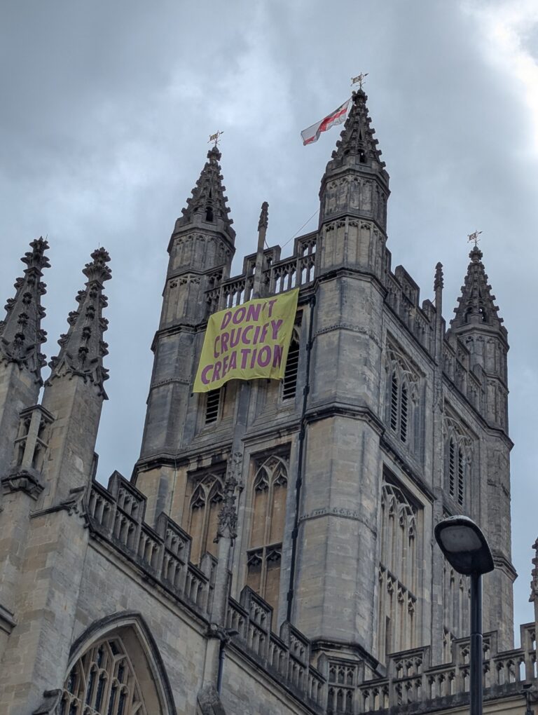 Christian climate protesters charged over banner drop from Bath Abbey