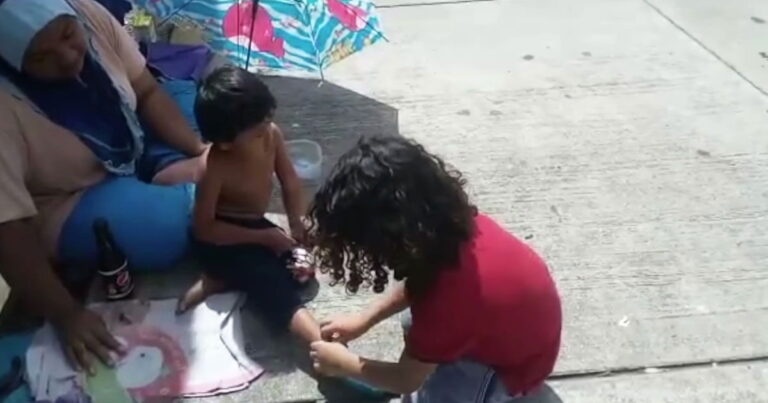 Young Malaysian Boy Shares Shoes with Homeless Child, Inspires Kindness.jpg