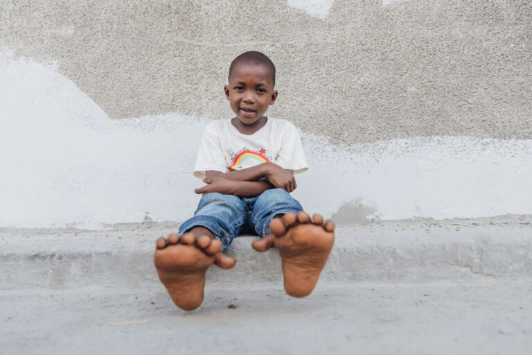 Boy born with six toes on each foot receives life-changing help from Christian charity
