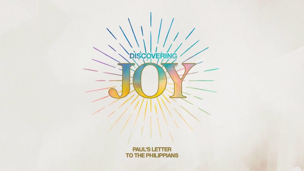 1783463112_maxresdefaultjpg - New Social Gospel Colorful sunburst graphic around the word JOY with 'DISCOVERING JOY' above and 'Paul's Letter to the Philippians' below.