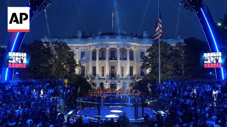 Nighttime scene of a packed crowd around an MMA ring in front of the White House, with blue lighting and an AP watermark in the corner.