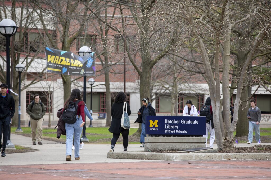 University of Michigan to Drop Letter Grades for Freshmen in - New Social Gospel University of Michigan students walk on campus in Ann Arbor, Mich., on April 3, 2025.