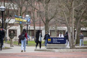 University of Michigan to Drop Letter Grades for Freshmen in - New Social Gospel University of Michigan students walk on campus in Ann Arbor, Mich., on April 3, 2025.