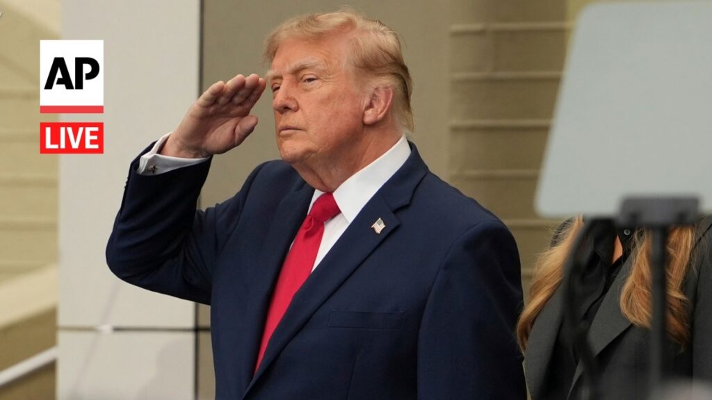 1789401021_maxresdefaultjpg - New Social Gospel Man in a navy suit saluting during a live AP news broadcast, AP Live logo on the left.