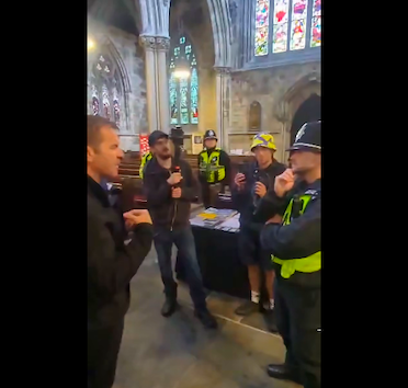 Apology issued after anti-immigration protesters confront clergyman inside church