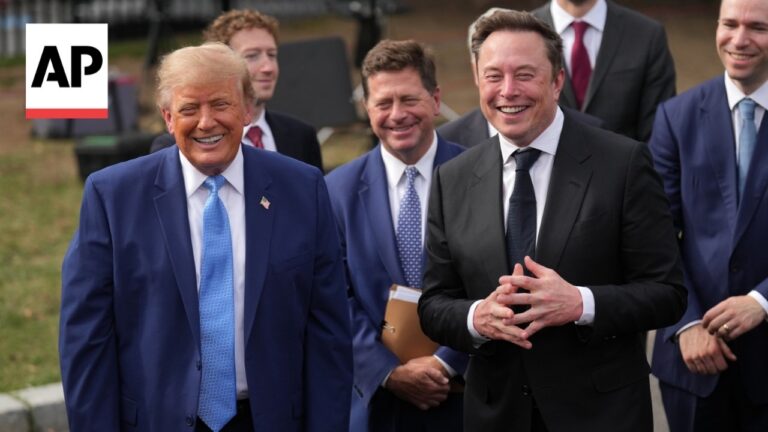 Group of suited men smiling outdoors at a public event, AP logo in the corner.